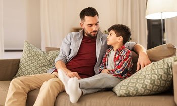 father having conversation with son